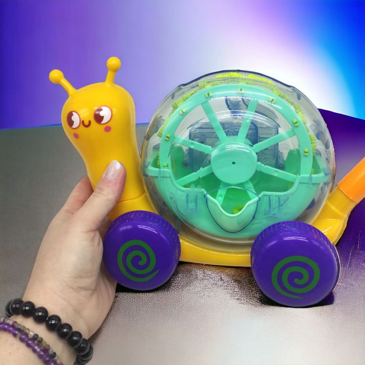 Іграшка "Равлик" 2 в 1: установка з мильними бульбашками та каталка (жовта)