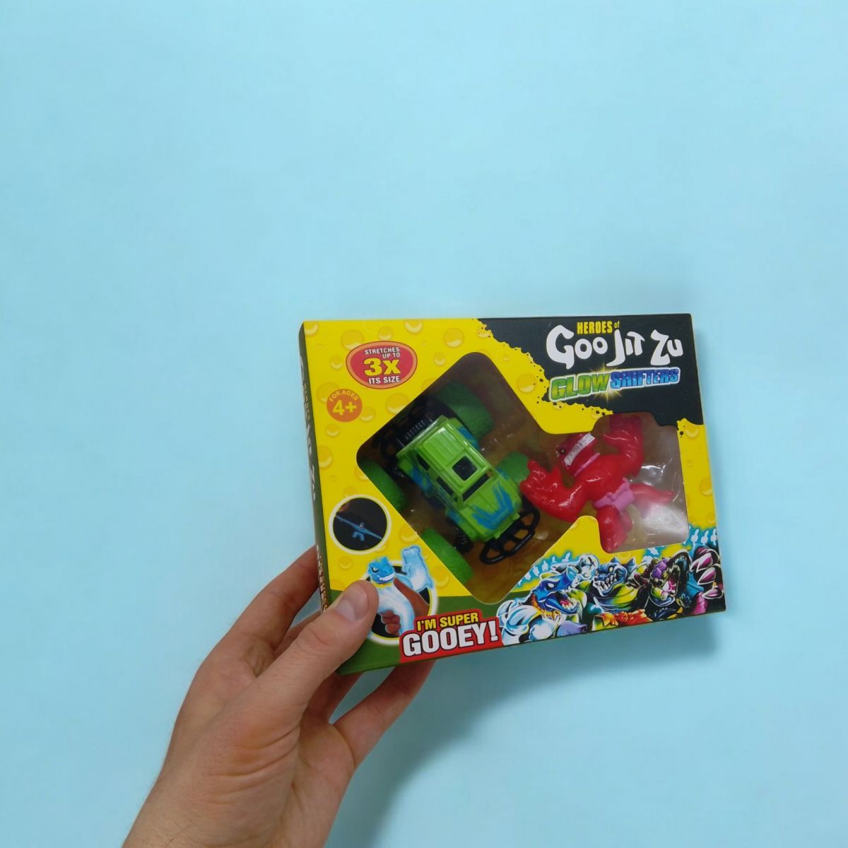 Антистрес тягнучка "Goo Jit Zu mini" герой + машинка зелена Антистрес тягнучка "Goo Jit Zu mini" герой + машинка зелена