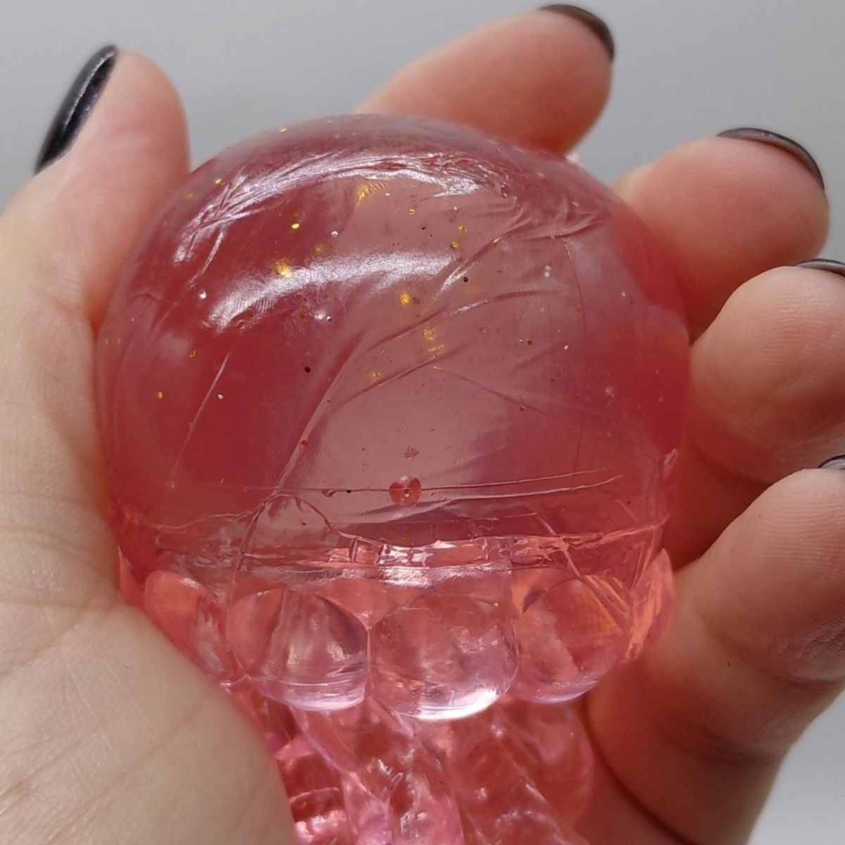 Іграшка-антистресс "Медуза" NeeDoh Jelly Squish Glow, 10 см (РОЖЕВИЙ)  фото 2
