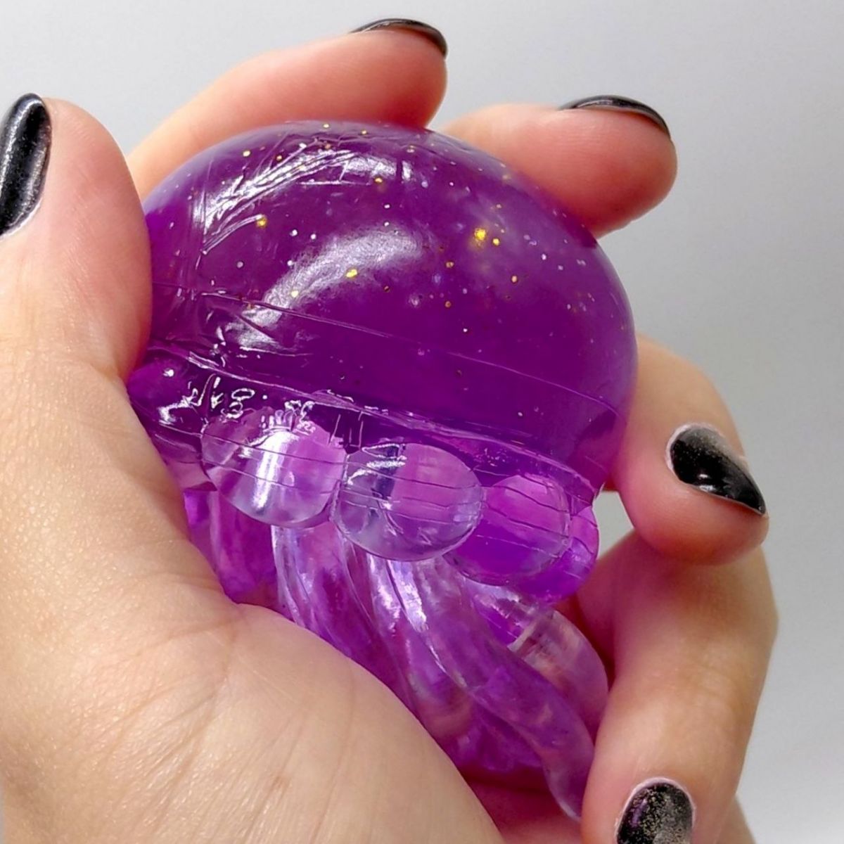 Іграшка-антистресс "Медуза" NeeDoh Jelly Squish Glow, 10 см (БУЗКОВИЙ)  фото 2