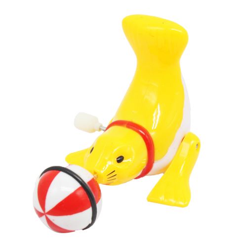 Заводная игрушка "Тюлень с мячиком", желтая фото